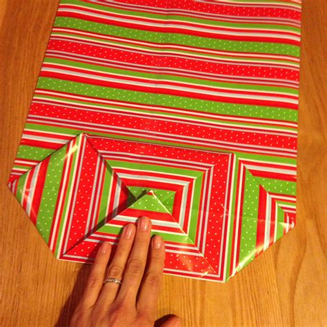 Stand your rolls of gift wrap up vertically, hang bags by their handle loops, and use the. How to make a gift bag out of wrapping paper! — Happy ...