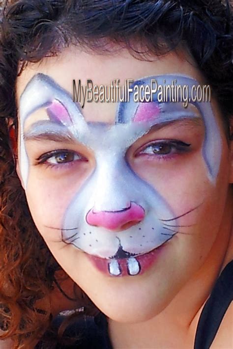 Nat's fancy faces sydney workshop. Easter bunny face paint. Tag white and grey split. Pink is ...