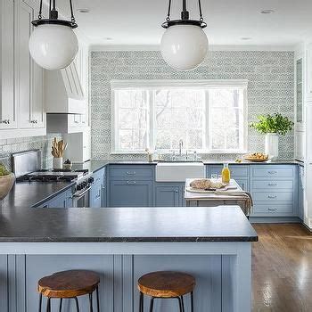 The darker bottom really grounds the lower cabinets and the white uppers make them almost disappear, making the kitchen look fresh and brand new! Stacked White Upper Cabinets and Blue Lower Cabinets - Transitional - Kitchen | Blue cabinets ...