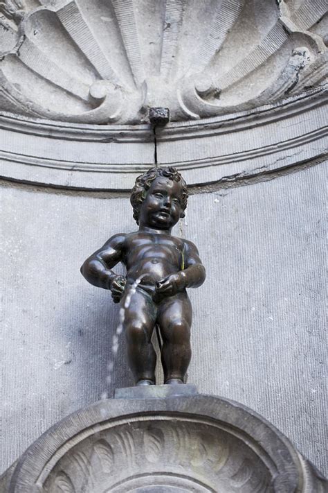 It would be time enough to give in, and make. Mannekin Pis Statue In Brussels Photograph by Leslie Banks