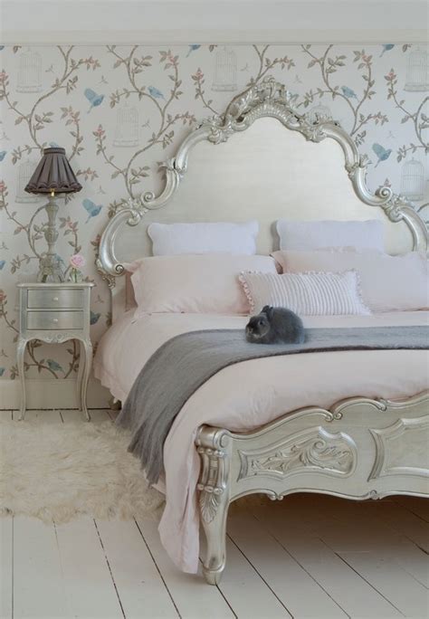 This shabby chic room incorporates floral accent cushions, laying around the pastel pink and white striped armchair. Shabby sheek or Shabby Chic bedroom design ideas