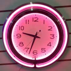 This impressive clock has two neon rings; Pink Double Neon Clock | Neon clock, Clock, Cool clocks