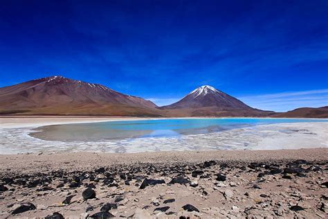 Red, green, yellow, or blue lagoons await you. Bolivian Salt Flats Tour | Wanderlusters