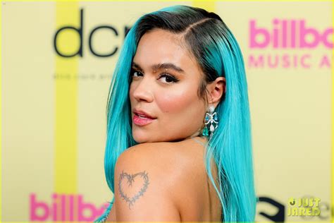 1 spot on billboard's top latin albums, spotify's top global album debuts and apple music's top latin albums. Karol G Rocks Bright Blue Hair & A Shimmering See-Through ...