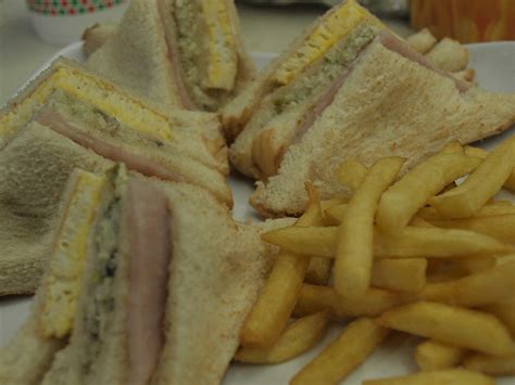 Traditional club sandwich recipe includes eggs, chicken, bread along common condiments however as a variation, different vegetables like cucumbers and tomatoes are also put into the sandwich. The awesome grind: My many favorites at Tropical Hut Hamburger