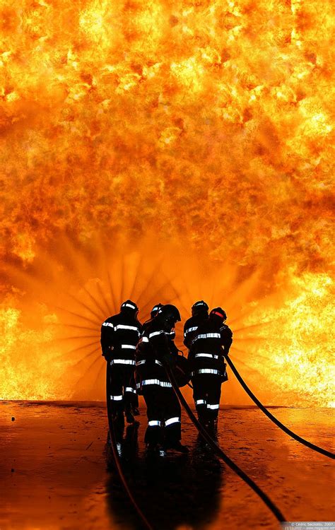The whispering wall is part of the barossa reservoir and is a popular tourist destination. Super Whisper Collection: Firefighters in front of a wall of fire