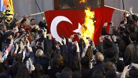 Flag desecration is the desecration of a flag, violation of flag protocol, or various acts that intentionally destroy, damage, or mutilate a flag in public. Turkish Flag Burning