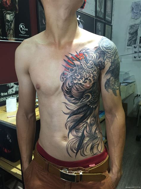 Một vị trí khác để xăm hình quan vũ đó chính là ở chân. hình xăm phượng hoàng ở tay - Tattoo Gà