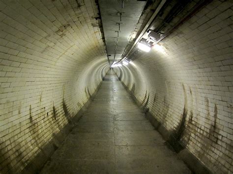 The greenwich foot tunnel connects greenwich to the isle of dogs with an underground walking trail that spans 370 meters in length and is rumored to be one the most haunted places in london. Greenwich Foot Tunnel | Running from Island Gardens in ...