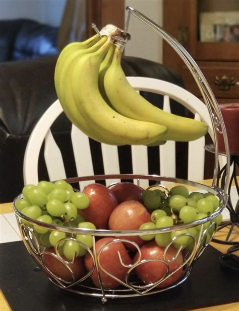 Simplehouseware fruit basket bowl with banana tree hanger, chrome finish. An elegant fruit basket with a banana hanger, so you can ...