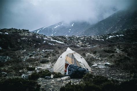 Sleeping in tent on side of mountain. The feeling of sleeping in a tent amongst the mountains is ...