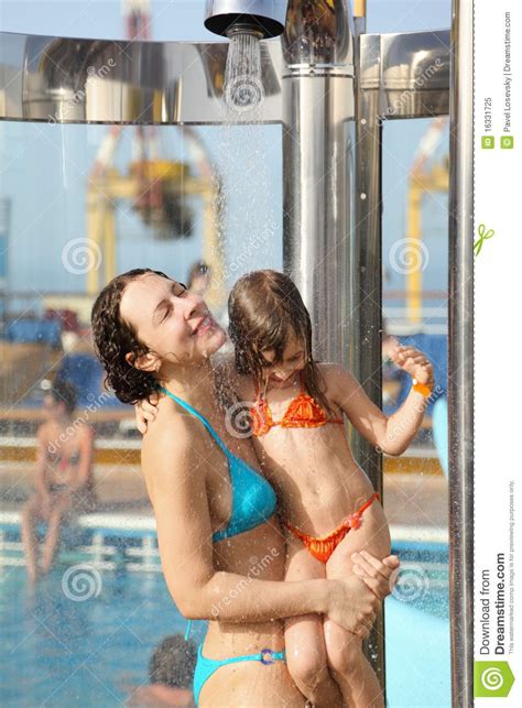 Saw something that caught your attention? Woman With Daughter Are Taking A Shower Royalty Free Stock ...