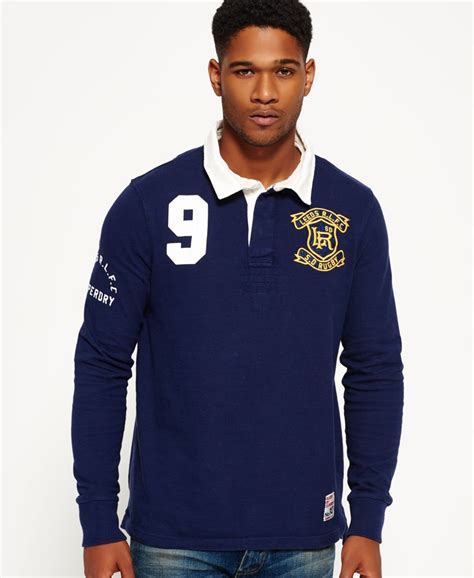 Rugbyshirts in vielen farben und größen im gant onlineshop bestellen | 0 € versand ✓ offizieller onlineshop ✓ premium qualität. Superdry Leeds Rhinos Rugby-Shirt - Herren Oberteile