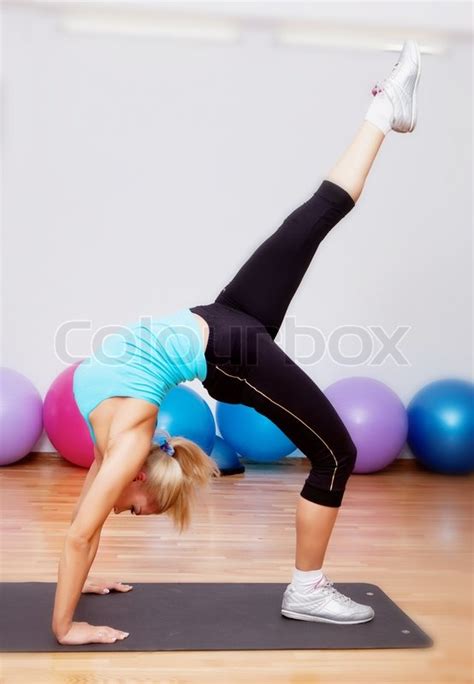 This is the bridge to do this sit on the floor cross leged now put your arms back all the way till they touch the floor and lift your feet up i suggest to do this on soft surface. Gymnastic bridge | Stock Photo | Colourbox