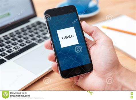 But at least the mystery is solved. Man Holding Iphone 6 Showing UBER App Editorial Image ...