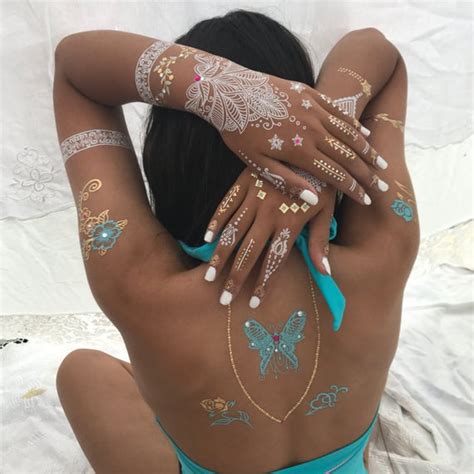 It usually depends on how long the mehandi pastel was left. Blue butterfly tattoo White henna and Crystal Tattoos x6