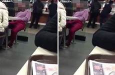woman caught masturbating public mcdonald bating mastur herself her restaurant while touch genitals china touches self appears sleeping videos groin