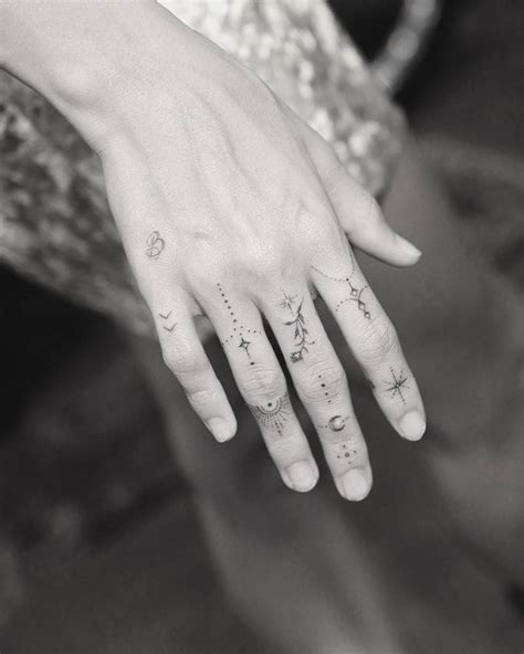 That's why we've curated all of her ink in one place and it's time you took a peek at her epic collection. "New hand adornments for Hailey Bieber"