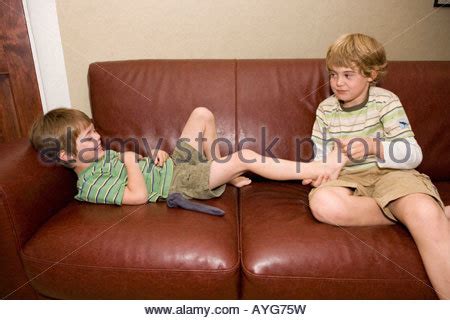 Going backstage with all these hotties is the best. Sibling teasing their older brother Stock Photo - Alamy