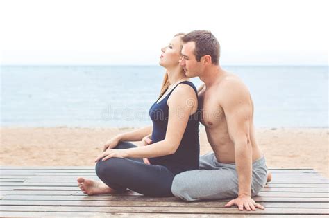 Your husband pregnant wife stock images are ready. Man And Pregnant Woman Are Doing Yoga On The Beach Stock ...