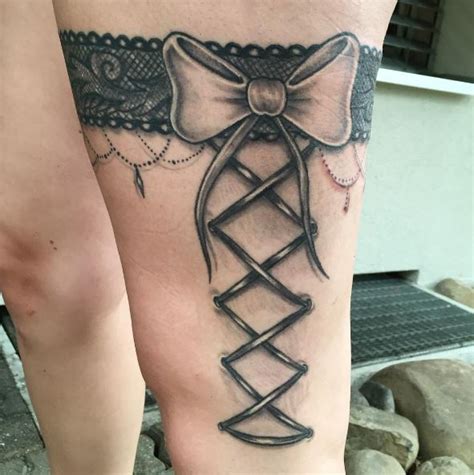 Popular garter tattoo designs since garter belts were worn on the thigh or just above the knee this is the exact placement. 50+ Lace Belt Garter Tattoos Designs (2020) Gun, Bow on ...