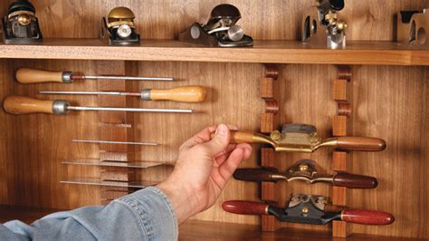 This way, no one will guest that there is a gun in it. Simple-to-Make Tool Holders for a Cabinet - FineWoodworking