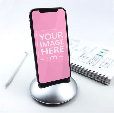 1242 x 2208 for an iphone. iPhone XS on Desk Standing on Dock Mockup Generator ...
