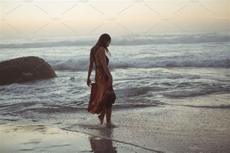 Download Rear view of woman posing on beach | High-Quality Stock ...