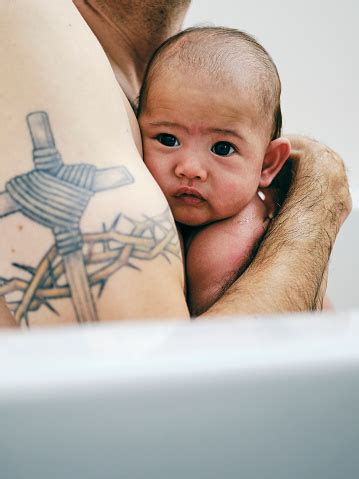 Feel free to hold your baby in the warm water for a few minutes following their bath if they seem to be enjoying it. Father Giving A Newborn Baby A Bath Stock Photo - Download ...