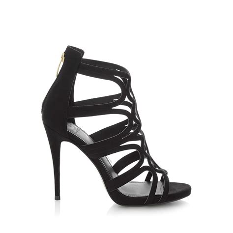 Découvrez notre collection de chaussures pas chères pour femmes avec chaussea, profitez d'un large choix de chaussures pour femmes au meilleur prix ! Guess Teigan - Sandales à talon - noir | BrandAlley