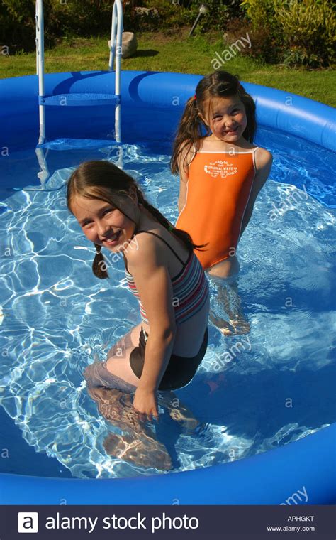 Also, apparently drink until you drop dead event lmao. Two girls in small swimming pool Stock Photo: 15795371 - Alamy