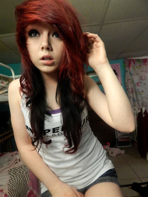 Emo hair is usually characterized by choppy layers, black or blonde hair with bright colors, and many emo hair styles start with a deep side part. Emo girl with curly brown hair - Epicsoid.com