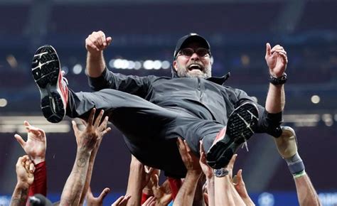 Liverpool's players celebrate after the final whistle goes. Champions League final: Tottenham 0-2 Liverpool AS IT ...