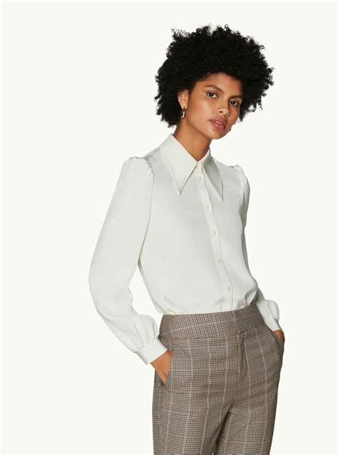 Tons of exclusive breast smothering content! Cat Off White Silk Blouse$199 USD This refined silk blouse is designed with an exaggerated point ...