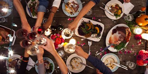 Asian people are eating dinner at home with friends, they are happy to talk. How to Throw a Millennial Dinner Party - Dinner Party How-To