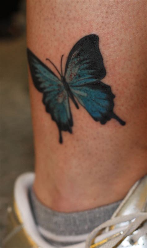 Rose tattoo can be mixed with other tattoos such as a butterfly tattoo. INK TATTOO: Butterfly, rose and text tattoo