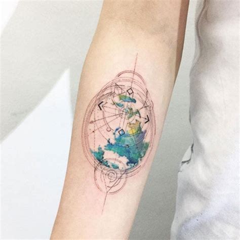 Watercolor tattoo on the arm. Watercolor Tattoos - Minimalist Tattoo Design Trend