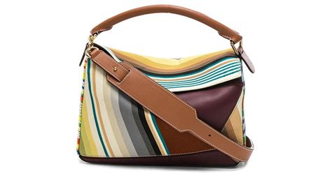 The bag is almost an architectural work of art with many angles, lines and corners. Loewe Canvas Striped Puzzle Bag - Lyst