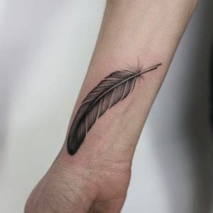 This tattoo is the mere representation of the elephant stuff toy which her boyfriend, louis tomlinson had gifted her. Eleanor Calder Feather Forearm Tattoo | Steal Her Style