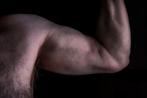 Will flexing muscles make you bigger? Senior Man Flexing Arm Muscles Stock Photo - Download ...