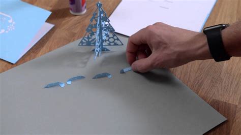 Move the tab up / down on the card and the window shrinks / expands like the iris of a camera lens (a real camera, not the camera on your cellphone.). Tis The Season Pop Up Cards - Assembly Tutorial - YouTube