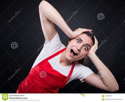 Terrified Girl With Apron Holding Her Head Stock Photo ...