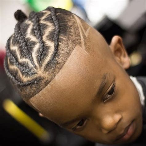 This is a stylish black boys' haircut that features a burst fade on the sides with sponge curls on the thick hair top. Black Boys Haircuts | Men's Haircuts + Hairstyles 2017
