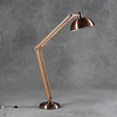Cone shape light cover in a matte black. copper angled floor lamp by the forest & co ...