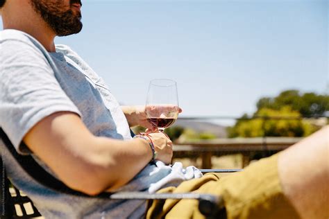 Huge collection, amazing choice, 100+ million high quality, affordable rf and rm images. Cropped view of man holding a glass of wine outdoors in a vineyard by Alejandro Moreno de Carlos ...