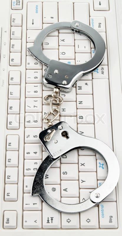 Make sure your mouse and/or keyboard are not paired to your laptop using bluetooth. A computer keyboard and handcuffs. ... | Stock Photo ...
