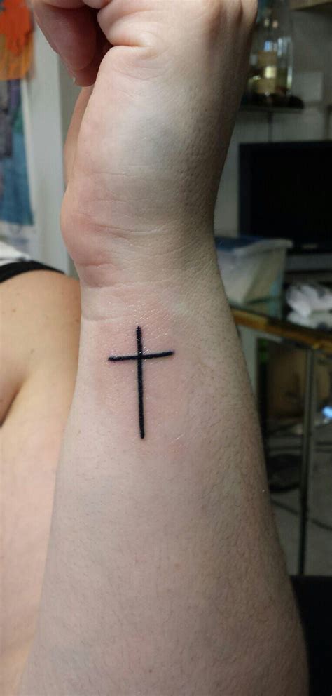 Often tattooed on the inside wrist, ankle, shoulder blade, or behind the ear, the small cross shows off your beliefs to the world, but in a. Pin on Tattoos