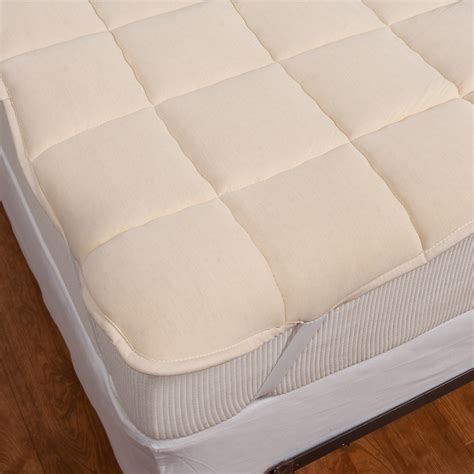 This luxury quilted mattress pad has a 100% cotton cover with a 300 thread count. DownTown Company Wool-Filled Mattress Pad - Queen