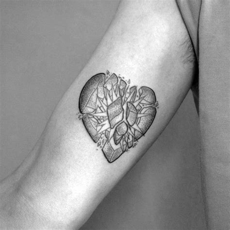 A heart tattoo can be in memory of a loved one, a broken heart. 40 Broken Heart Tattoo Designs For Men - Split Ink Ideas