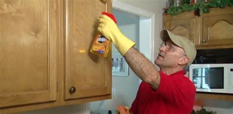 Apply the mix to the surface, allow to sit for 10 minutes and scrub with a damp sponge. How to Remove Grease from Kitchen Cabinets | Today's Homeowner